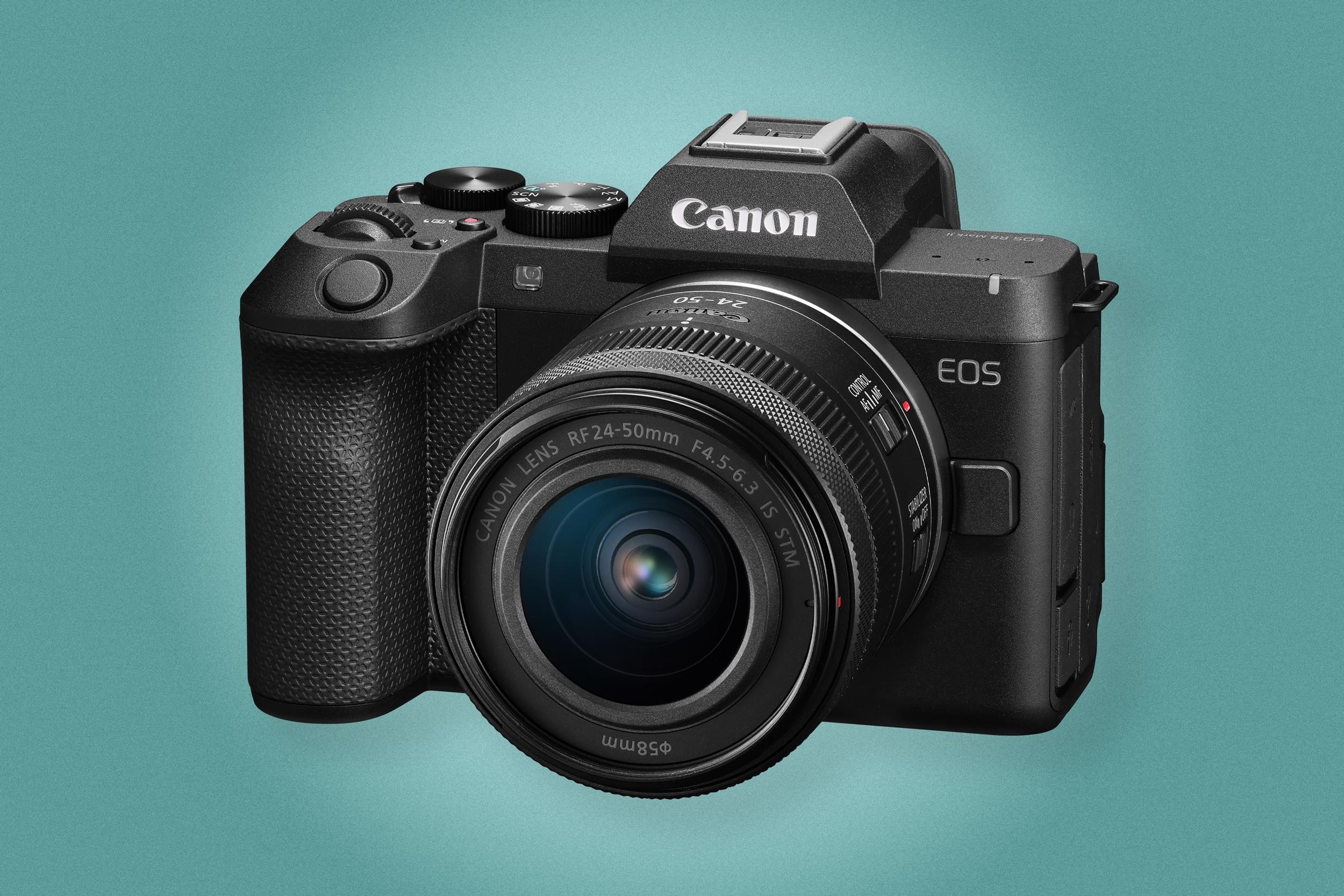 The Canon EOS R8 Mark II with a lens attached against a green background.